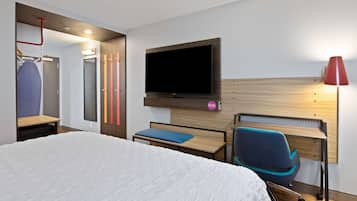 Premium bedding, desk, laptop workspace, blackout drapes