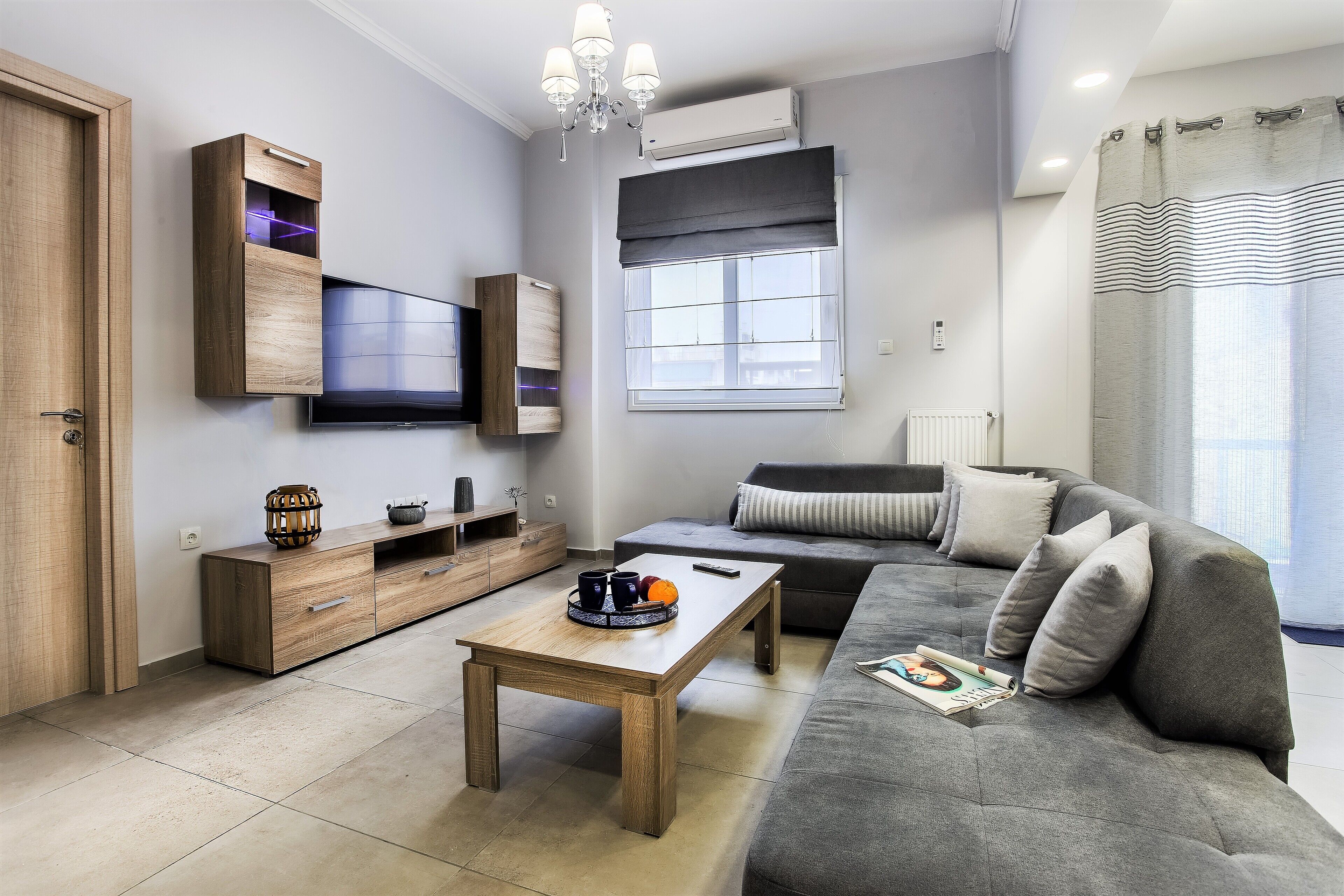 Apartment, City View | Living area | Flat-screen TV