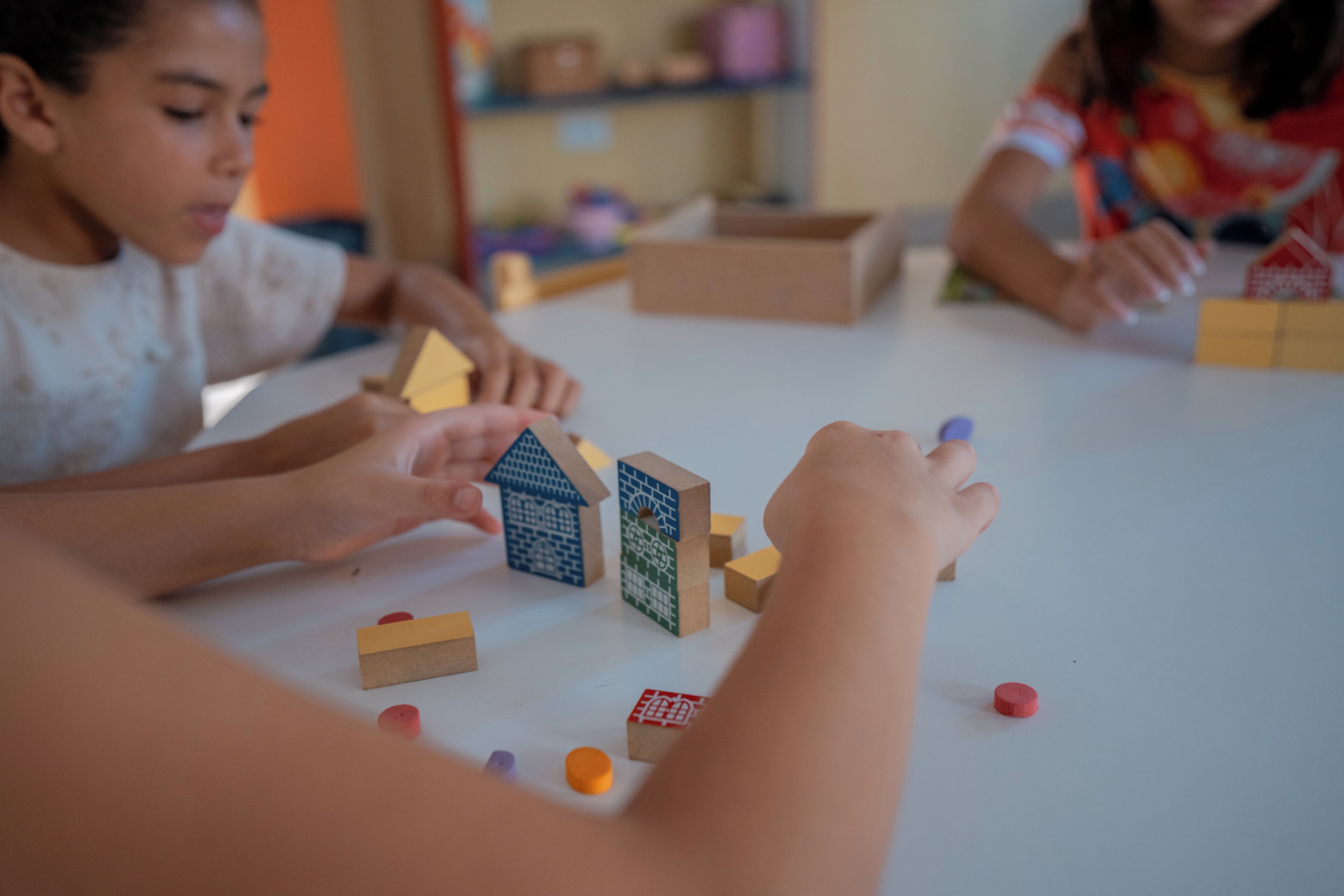 A table with wooden blocks and a few scattered items.