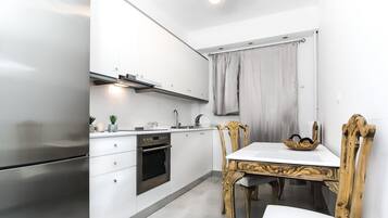 Apartment | Private kitchen | Full-size fridge, microwave, oven, stovetop