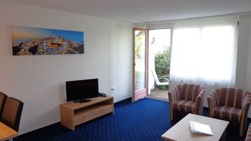 Apartment, 1 Bedroom | Living room | 100-cm LCD TV with cable channels, TV