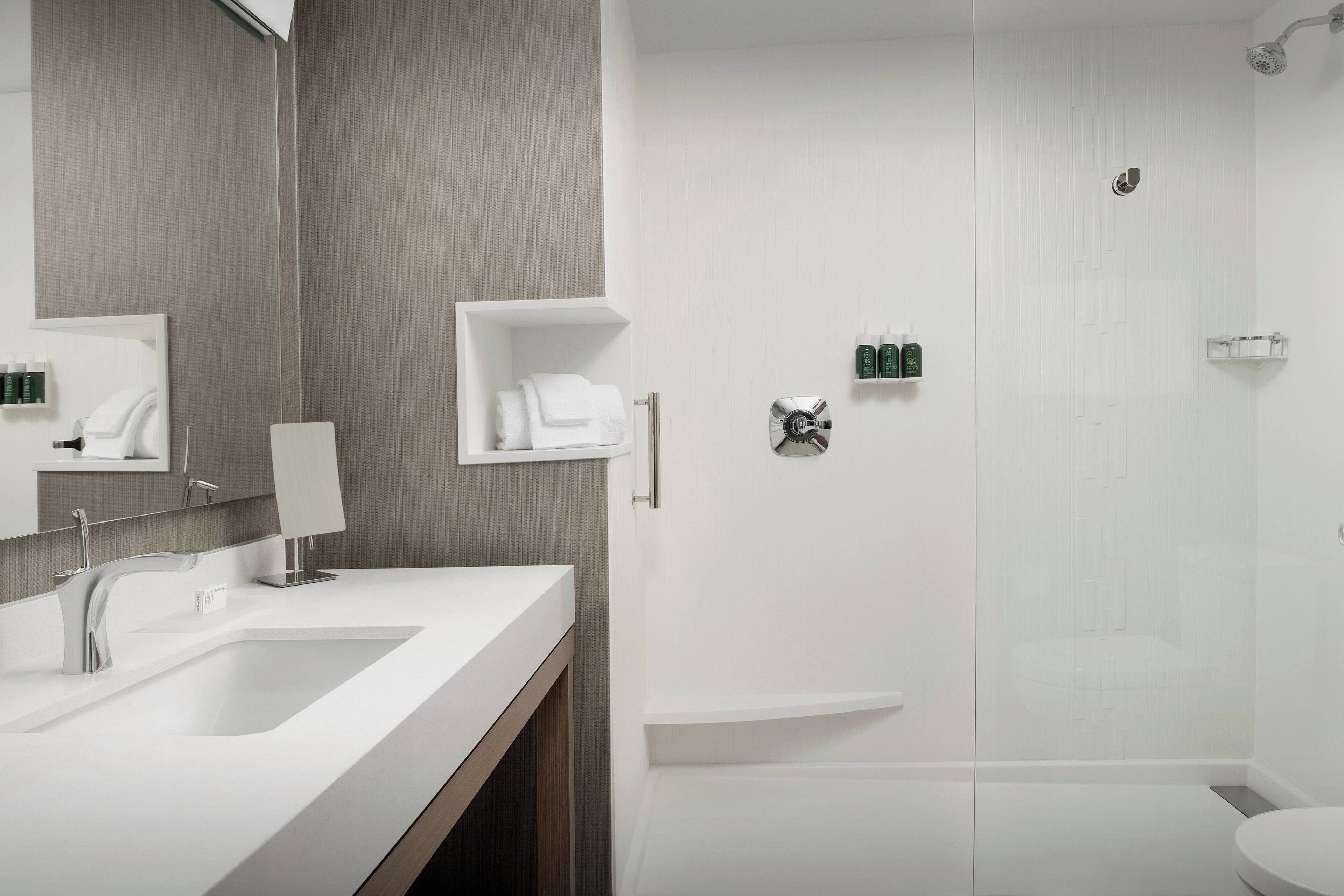 room, 1 king bed with sofa bed, non smoking | bathroom | eco-friendly toiletries, hair dryer, towels, soap