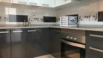 Microwave, dishwasher, dining tables