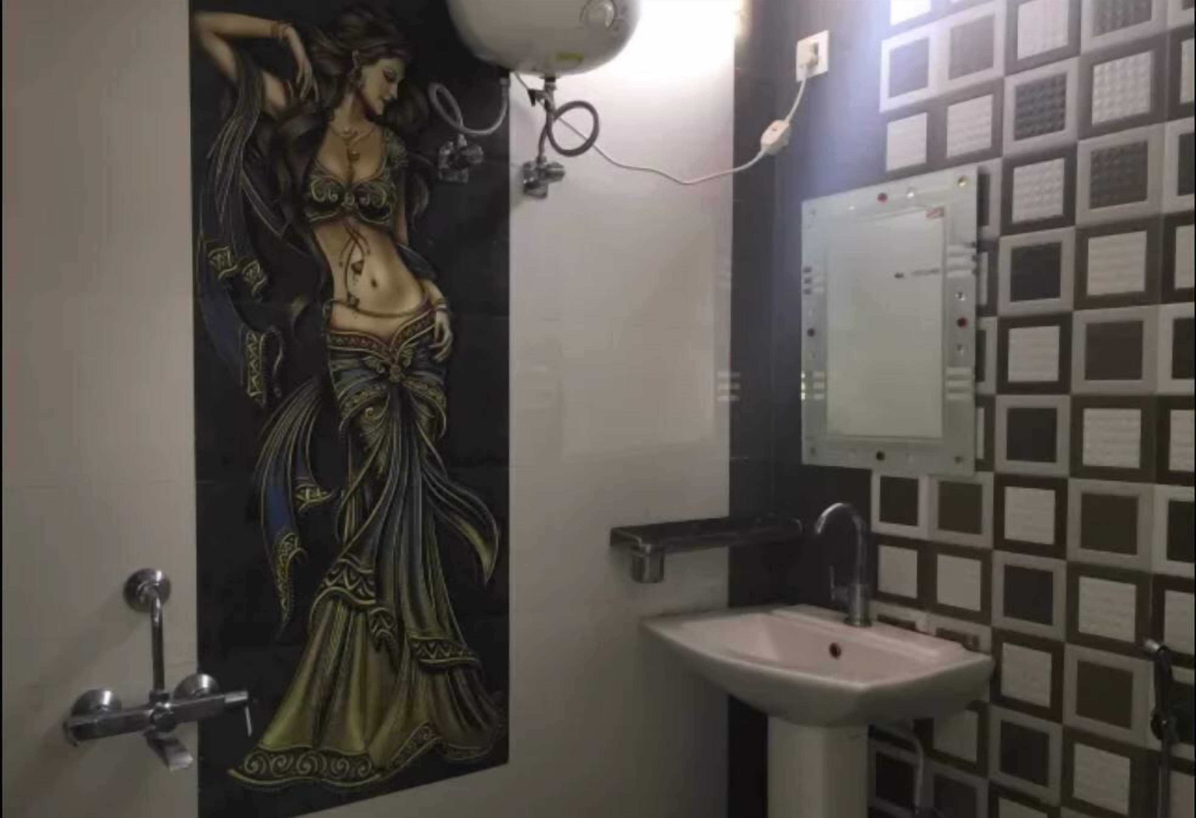 A bathroom with a decorative wall mural, a sink, and a mirror.