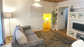 Apartment, 2 Bedrooms | Living room | Flat-screen TV, DVD player