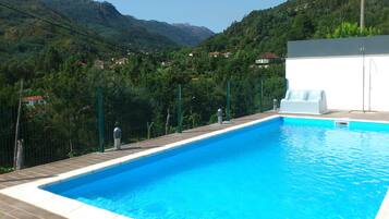Seasonal outdoor pool, pool loungers