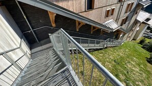 A multi-level building with a staircase leading to an upper floor. - Luxury flat for 8 people - modern, central, ski in ski out (Châtel)