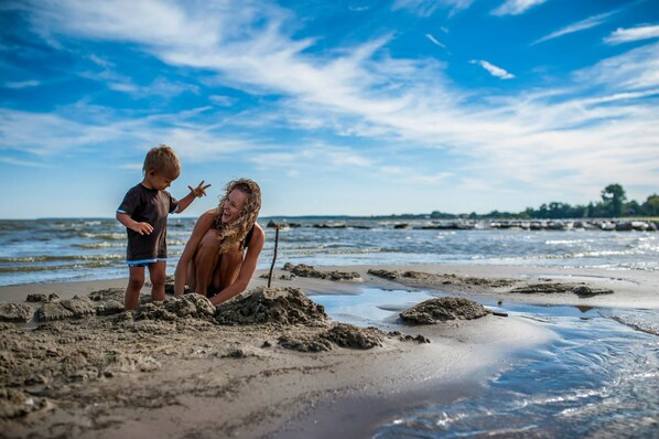 On the beach, sun-loungers