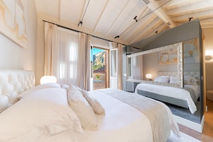 Deluxe Queen Suite | 1 bedroom, in-room safe, individually decorated, individually furnished