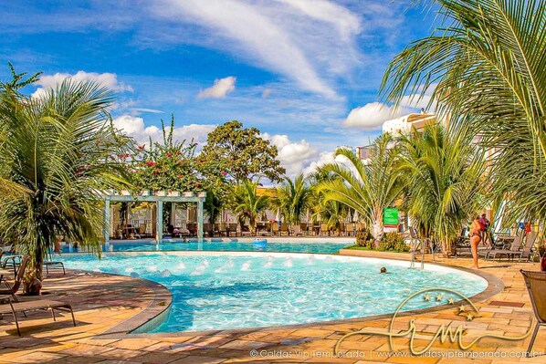 15 outdoor pools, pool umbrellas, pool loungers