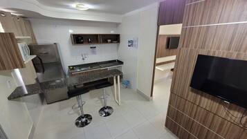 Fridge, microwave, cookware/dishes/utensils