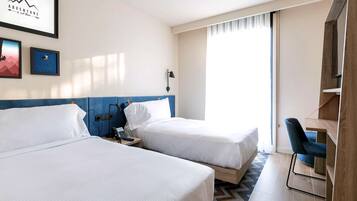 Twin Room, 2 Single Beds | Minibar, in-room safe, individually furnished, desk
