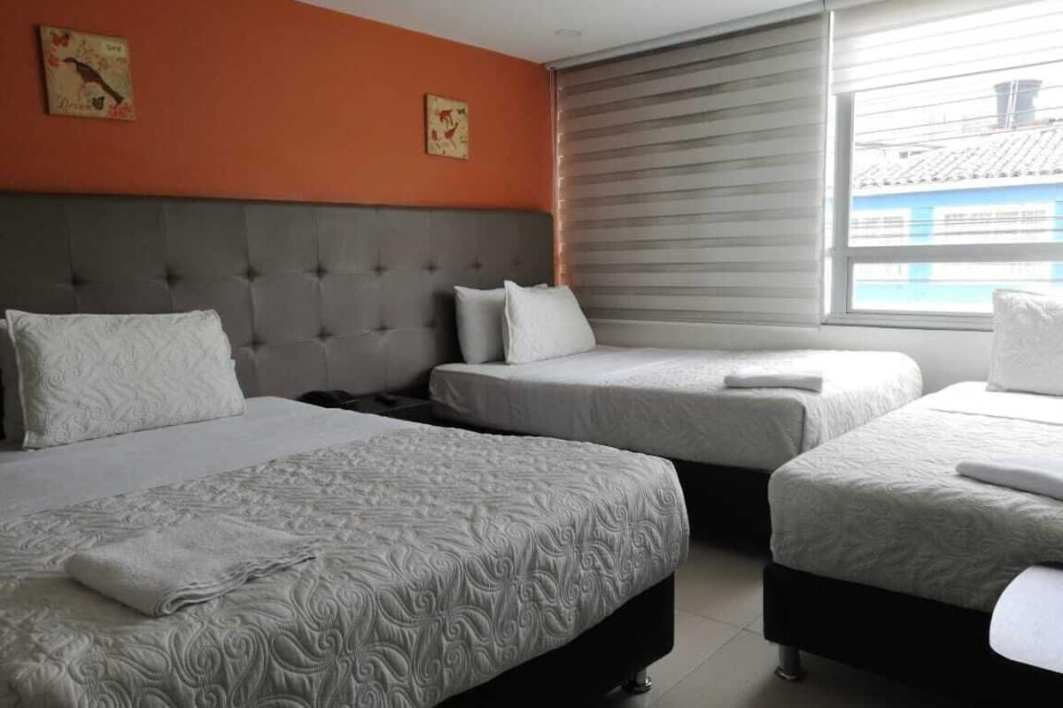 Triple Room | Minibar, in-room safe, desk, laptop workspace
