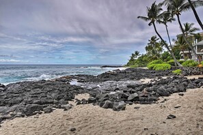 Experience the serene beauty of the ocean's edge, where rocky shores meet the sea.