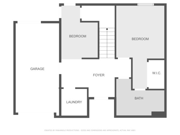 Un plan d’étage comprenant un garage, deux chambres, un hall d’entrée, un espace buanderie, une salle de bain et un dressing.