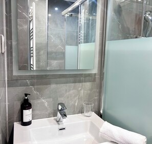 Shower, hair dryer, towels
