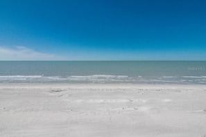 On the beach, sun loungers, beach towels