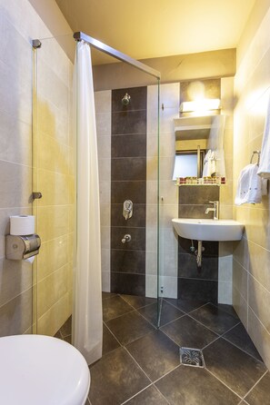Family Apartment | Bathroom | Shower, free toiletries, slippers, towels - CityHome Aparthotel (Sofia)