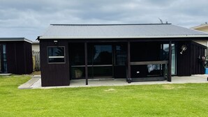 A modern building with a flat roof and large windows.