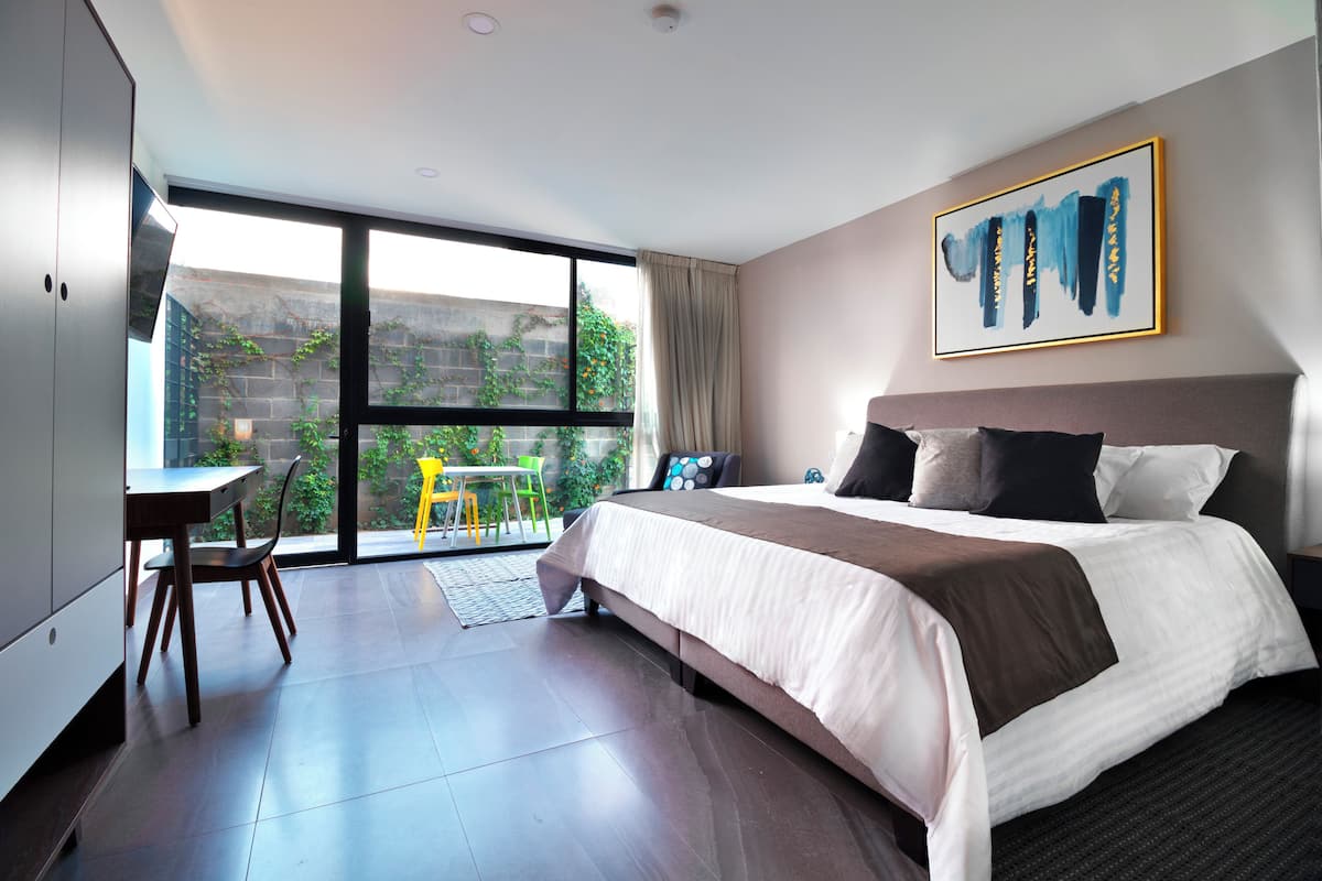 Comfort Studio, 1 Bedroom, Patio | Down duvets, in-room safe, desk, laptop workspace