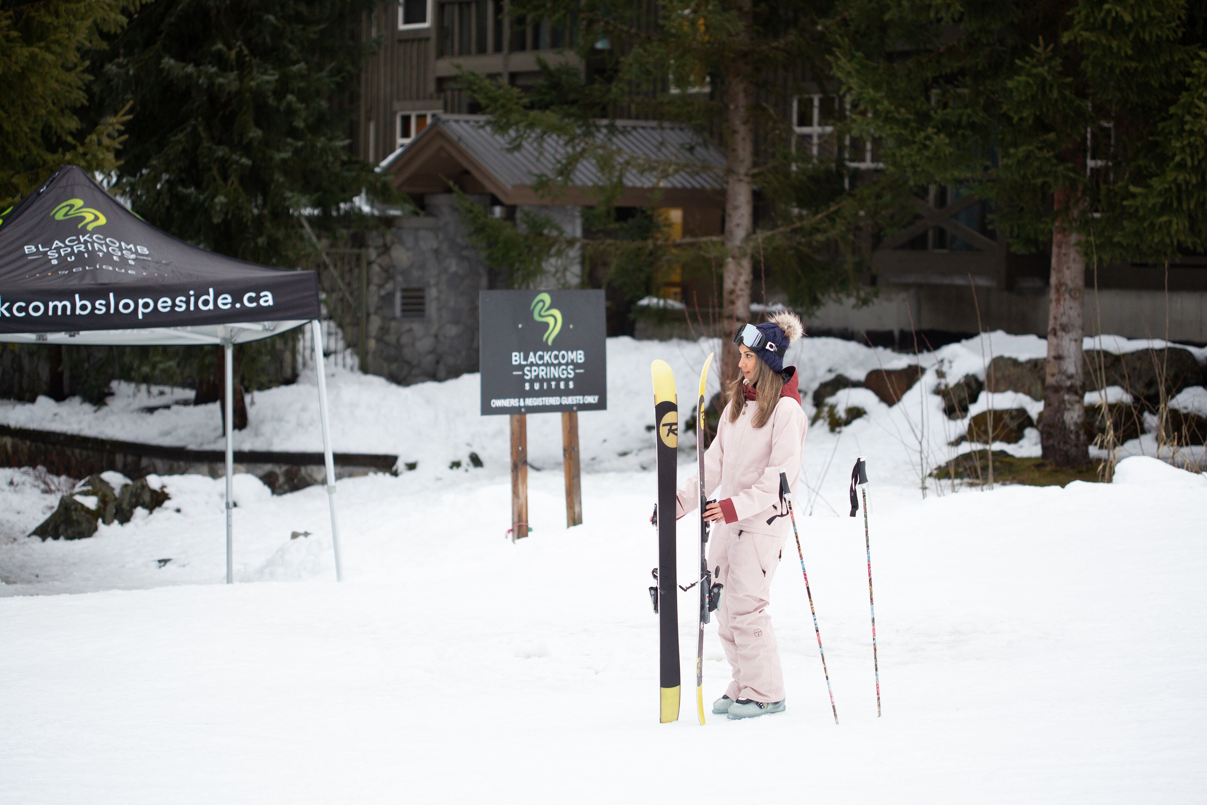 A ski resort with a tent labeled "Blackcomb Slopeside" and a sign for "Blackcomb Springs - Suites Only".