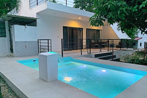 Designer Villa with private Pool and Rooftop Lounge in Tropical Garden