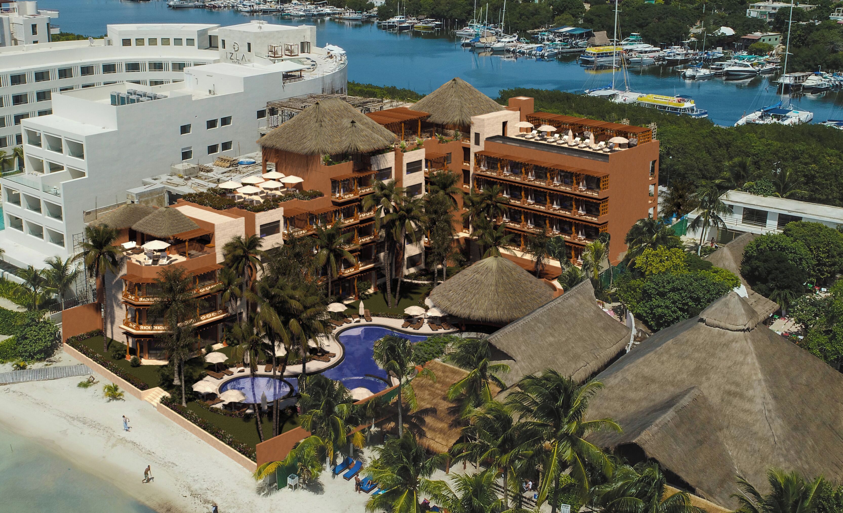 Um resort com vários edifícios, piscina e marina com barcos.
