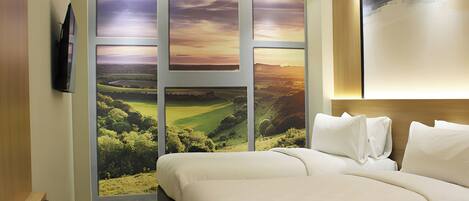 A hotel room with a large window, a bed, a TV, and a wooden headboard.