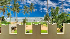A view of a beach with palm trees and a clear sky. - Akurala Beach Boutique Resort (Akurala)