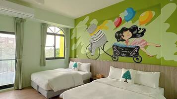 A hotel room with two beds, a mural on the wall, and a large window.