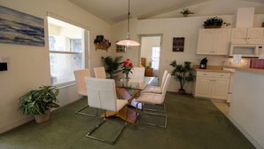 A modern kitchen with white cabinets, a microwave, and a coffee maker on the counter. - Perfect Family Gateway At Silverthorne 3 Bedroom Home by RedAwning (Hernando)