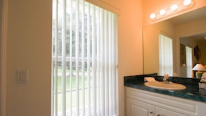 A bathroom with a window, a sink, and a mirror. - Perfect Family Gateway At Silverthorne 3 Bedroom Home by RedAwning (Hernando)
