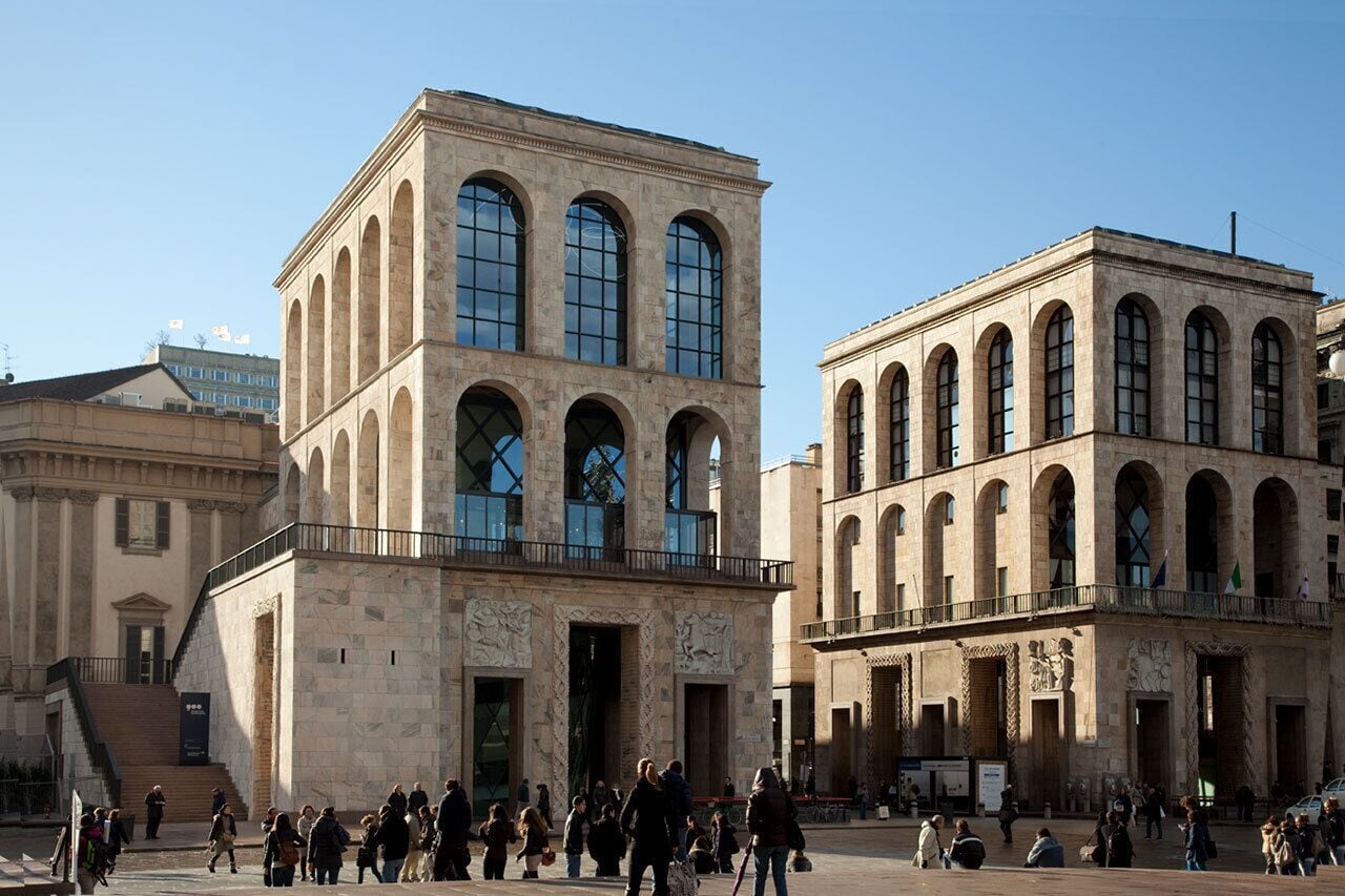 A historic building with arched windows and a central entrance.