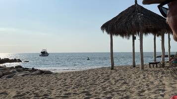 On the beach, sun-loungers, beach towels