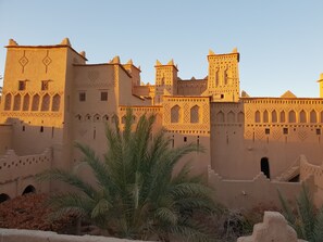 A traditional building with intricate architectural details, including arched windows and decorative patterns.