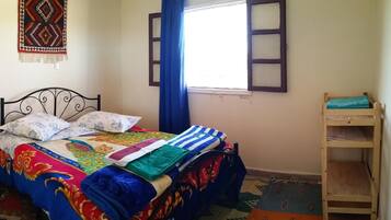 Desk, laptop workspace, iron/ironing board, cribs/infant beds