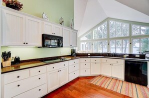 Enjoy cooking in this well-equipped kitchen with a microwave, coffee maker, and sink.