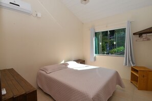 Apartamento standard | Cortinas blackout, Wi-Fi de cortesia, roupa de cama