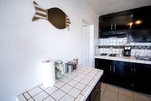 Fridge, stovetop, coffee/tea maker, cookware/dishes/utensils