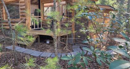 The Moon and You-
Unique creek side off grid 1-bedroom cabin with glass roof