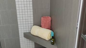 Shower, hair dryer, bathrobes, towels
