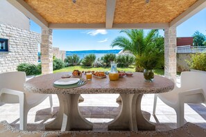 Outdoor dining - Villa Oslo - luxury place with sea views & heated pool, 300m from sandy beach (Omis)