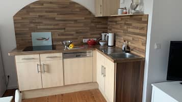 Fridge, stovetop, dishwasher, coffee/tea maker