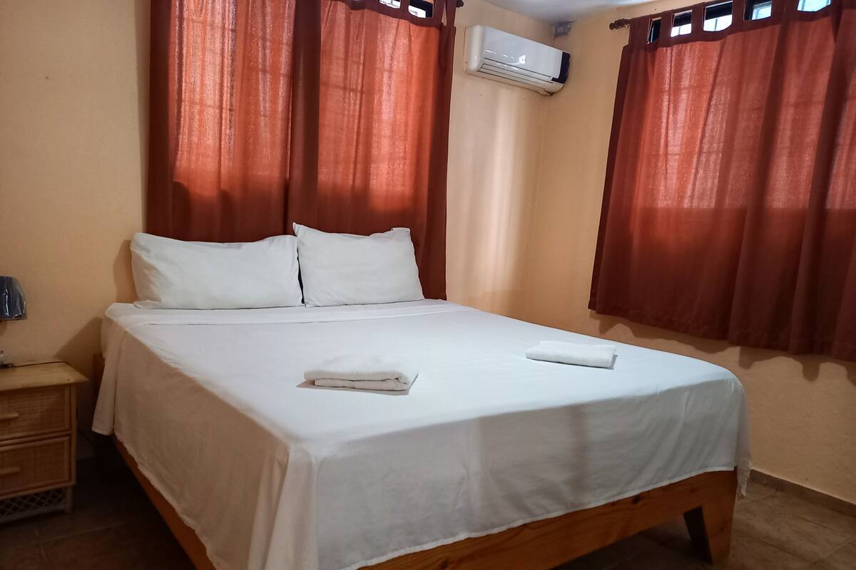 Senior Apartment, 2 Bedrooms, Courtyard View, Corner | Hypo-allergenic bedding available, in-room safe, blackout drapes