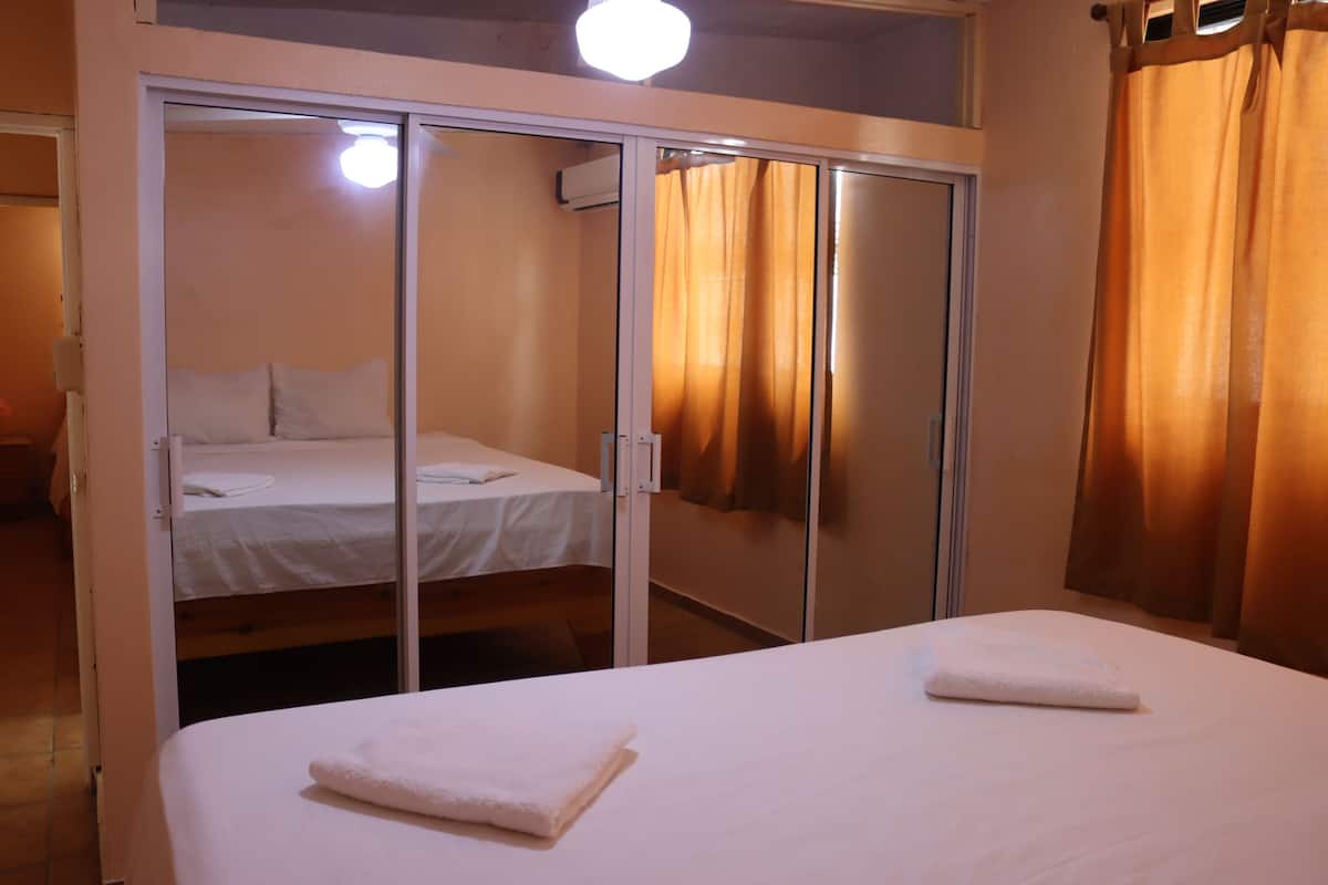 Premium Apartment, 2 Bedrooms, Partial Ocean View, Corner | 1 bedroom, hypo-allergenic bedding, in-room safe, blackout curtains