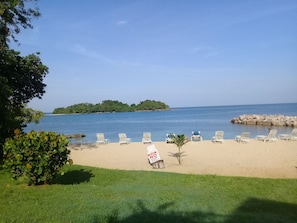 On the beach, sun-loungers