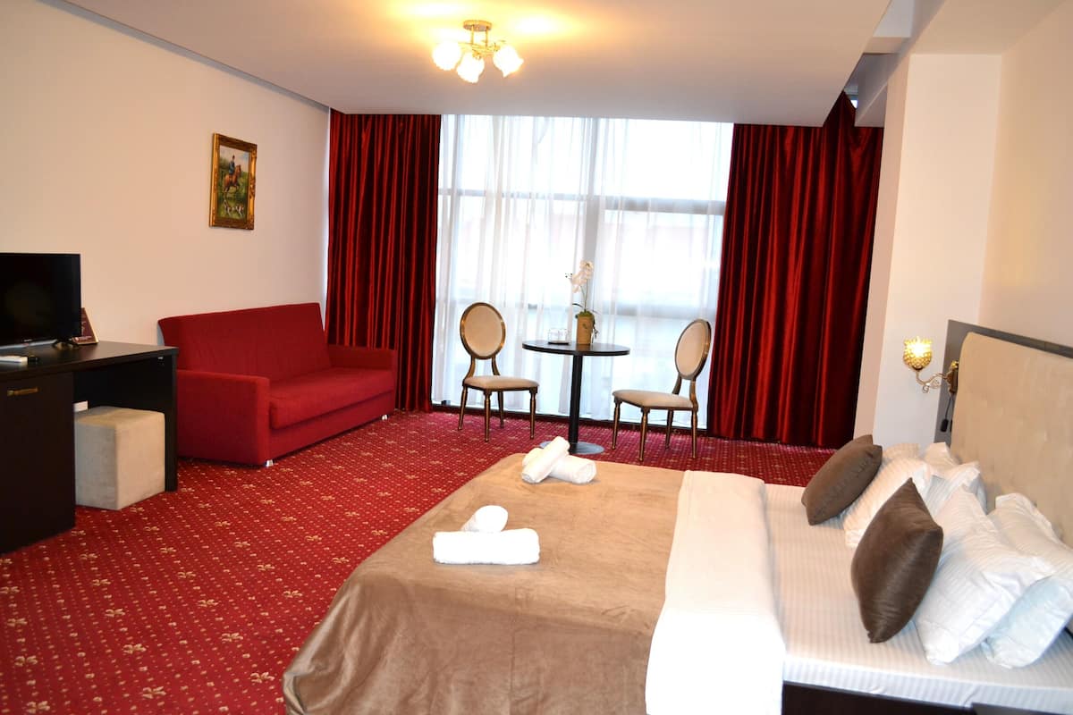 Premium bedding, desk, laptop workspace, iron/ironing board