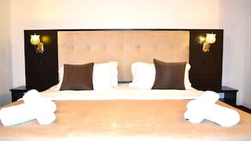 Premium bedding, desk, laptop workspace, iron/ironing board