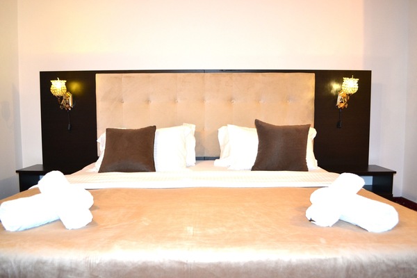 Premium bedding, desk, laptop workspace, iron/ironing board