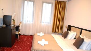 Premium bedding, desk, laptop workspace, iron/ironing board